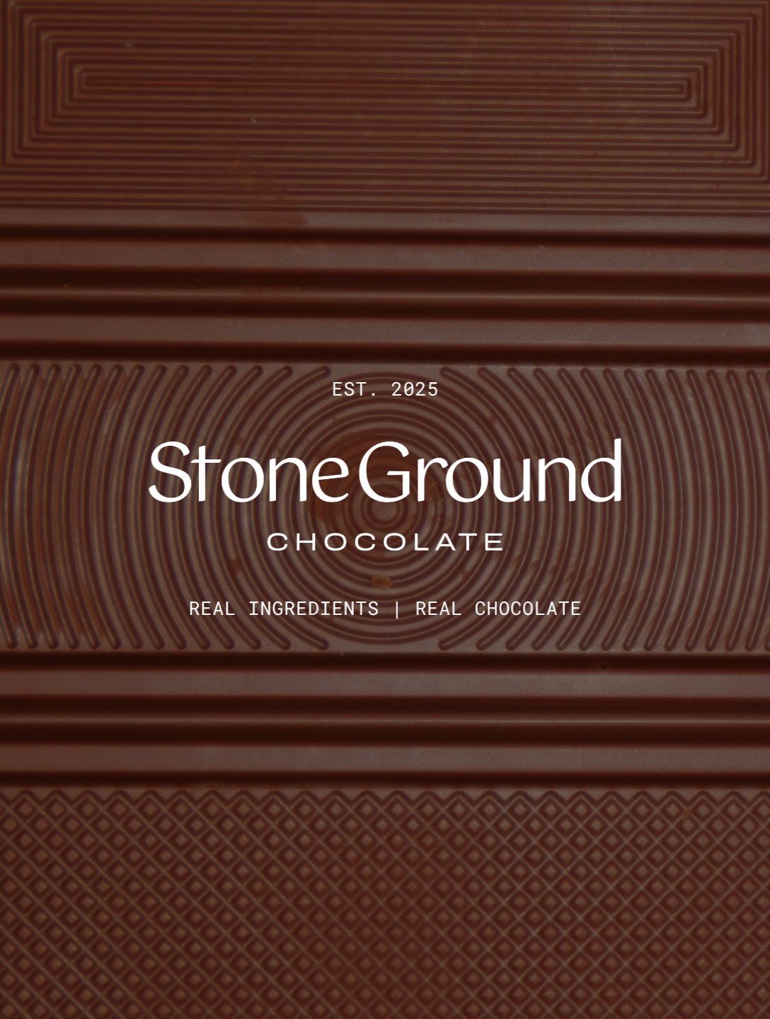 StoneGround Chocolate branding on a patterned chocolate slab