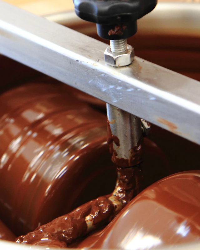 Chocolate running through a melanger